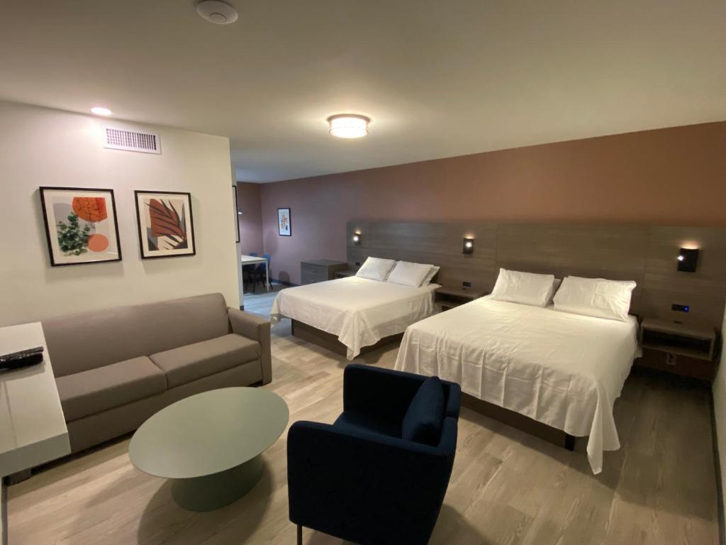 Postel nebo postele na pokoji v ubytování Rolo Beach Hotel