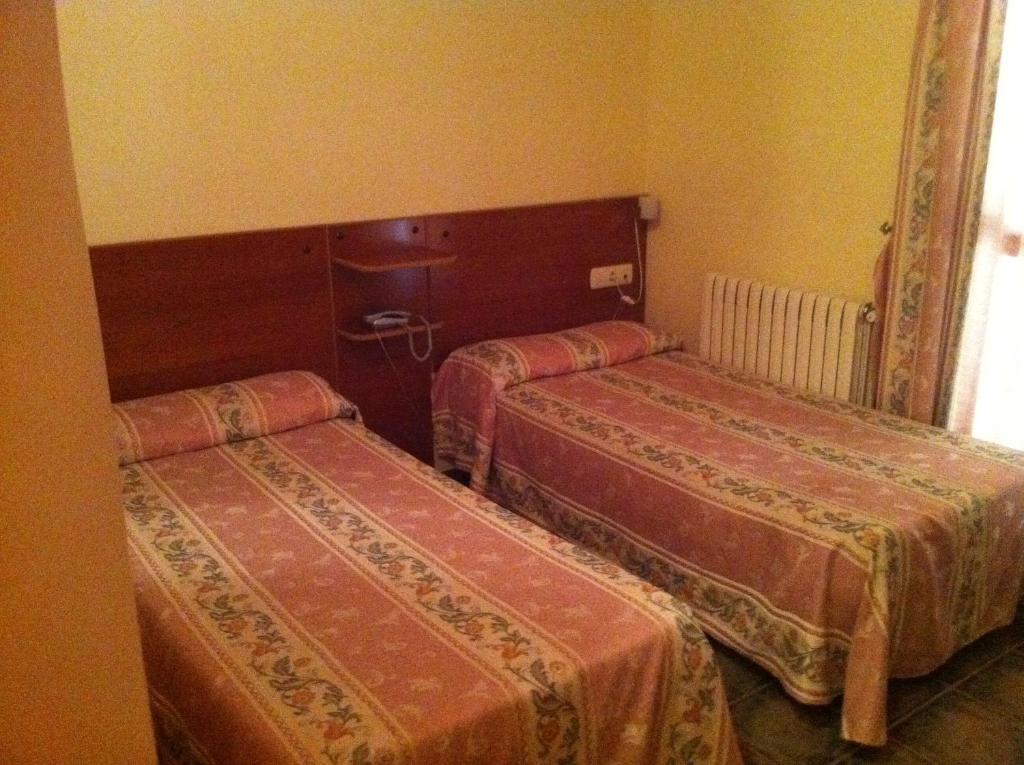Postel nebo postele na pokoji v ubytování Hotel El Zorro
