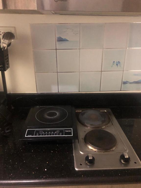 Kuchyň nebo kuchyňský kout v ubytování Staycation