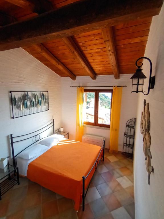 A bed or beds in a room at La Villa Tanca Piras