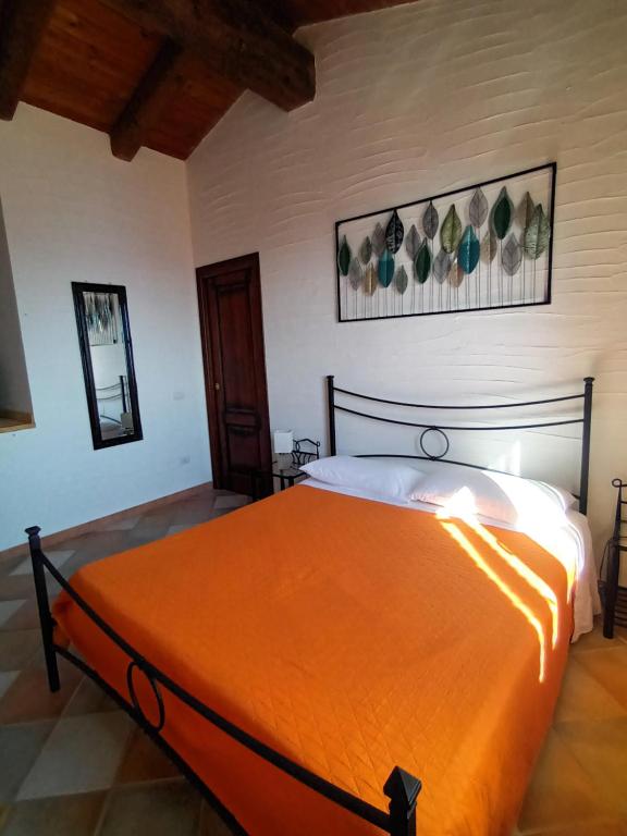A bed or beds in a room at La Villa Tanca Piras