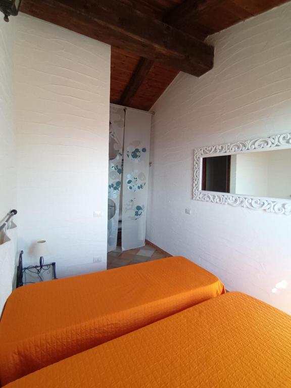 A bed or beds in a room at La Villa Tanca Piras