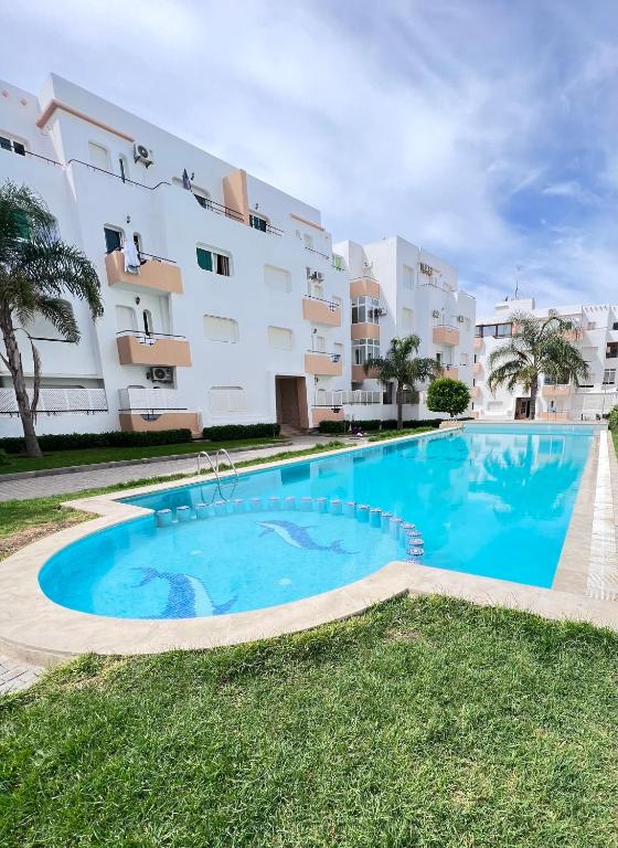 a large swimming pool in front of a building at The Paradise of ACHAKAR in Tangier