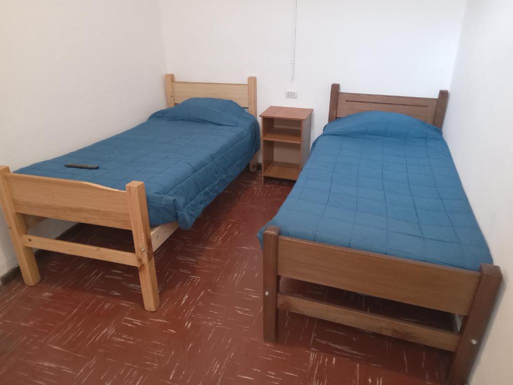 Postel nebo postele na pokoji v ubytování Hostal 4 Estaciones
