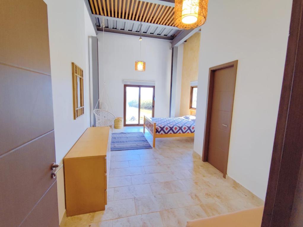 Postel nebo postele na pokoji v ubytování Kasakai Beachouse