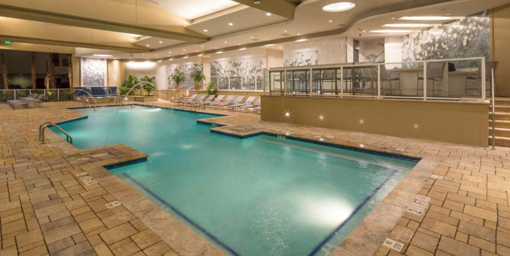 a large swimming pool in a hotel lobby at Hilton Grand Vacations Club Ocean 22 Myrtle Beach in Myrtle Beach