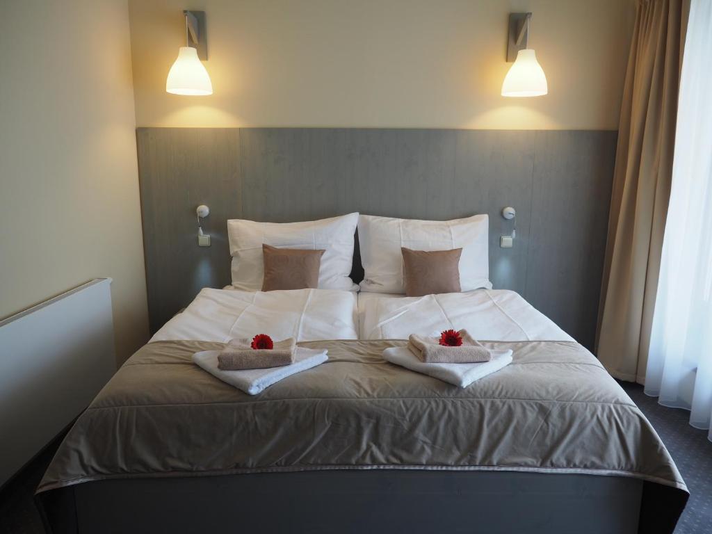 Postel nebo postele na pokoji v ubytování Hotel Výpřež - Děčín
