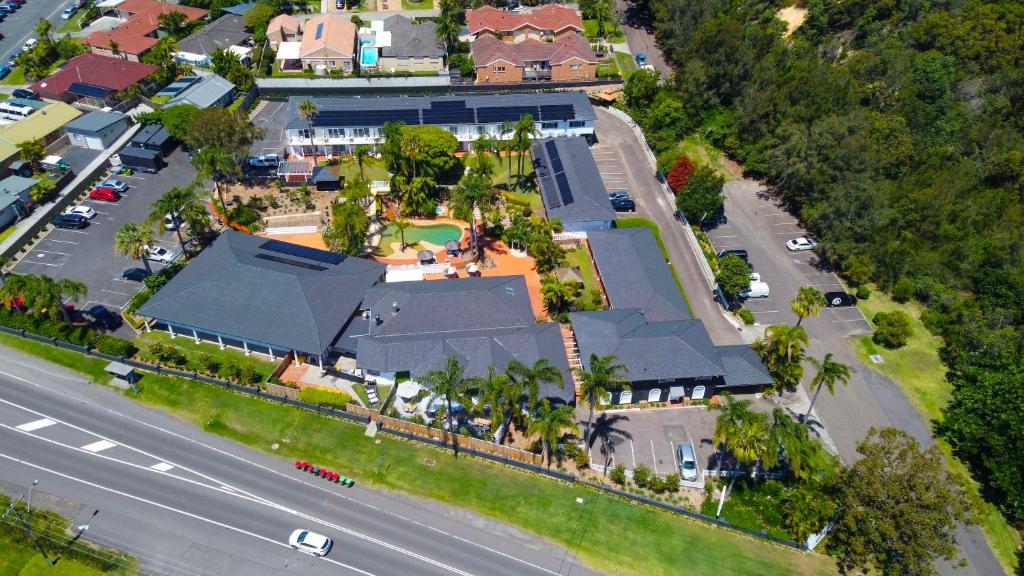 an overhead view of a house with a street at The Quarters, Ascend Hotel Collection in Wamberal