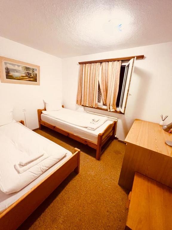 Postel nebo postele na pokoji v ubytování Apartment with balcony and Panoramic Views of Alps