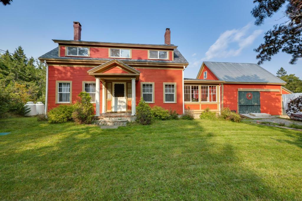 an old red house with a large yard at Oceanfront Milbridge Getaway with Deck and Views! in Milbridge