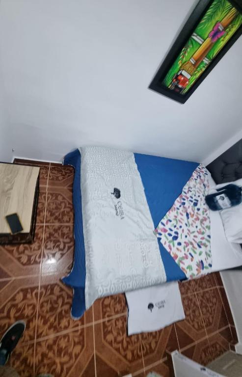 Postel nebo postele na pokoji v ubytování Ayenda Ceiba Rooms