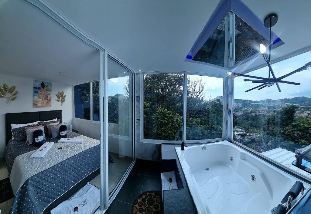 Postel nebo postele na pokoji v ubytování Ayenda Ceiba Rooms
