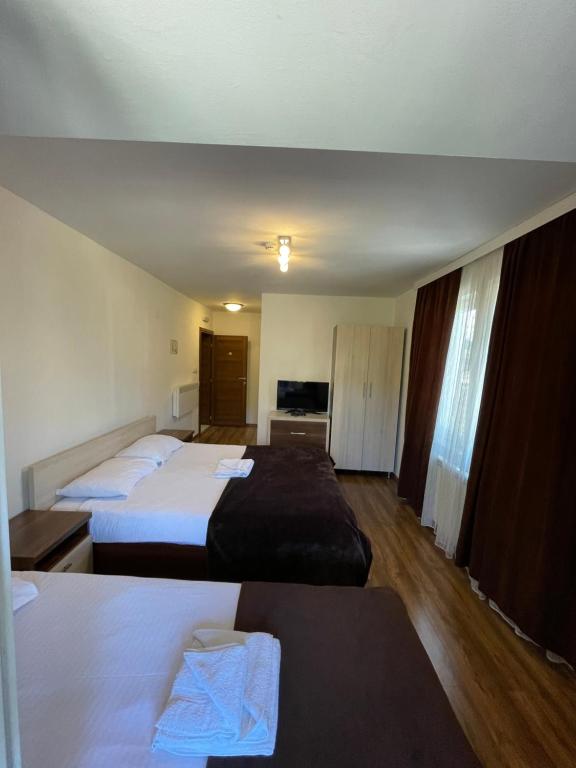 Postel nebo postele na pokoji v ubytování Motel & Restaurant Dar