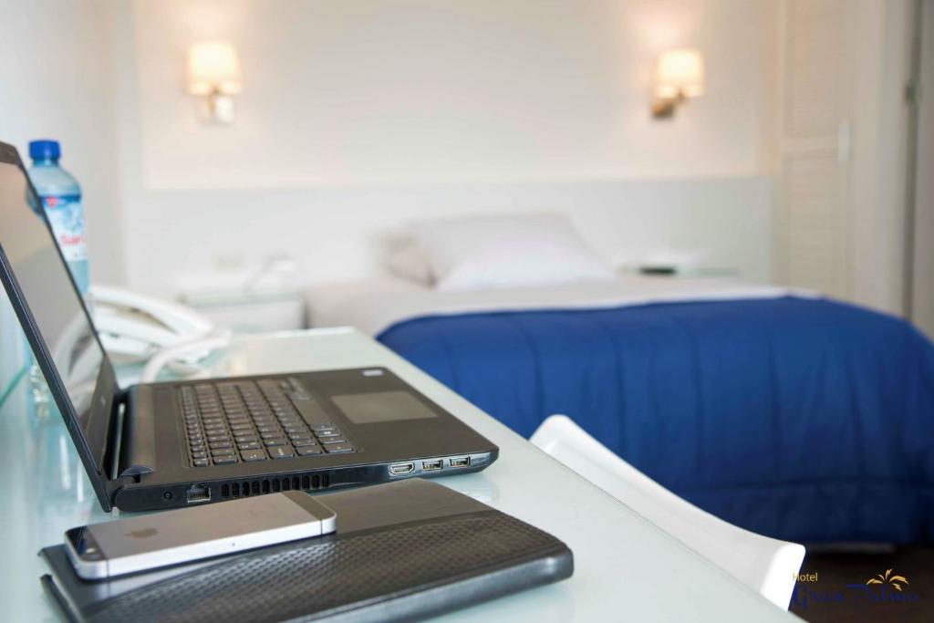 Postel nebo postele na pokoji v ubytování Hotel Gran Palma Piura
