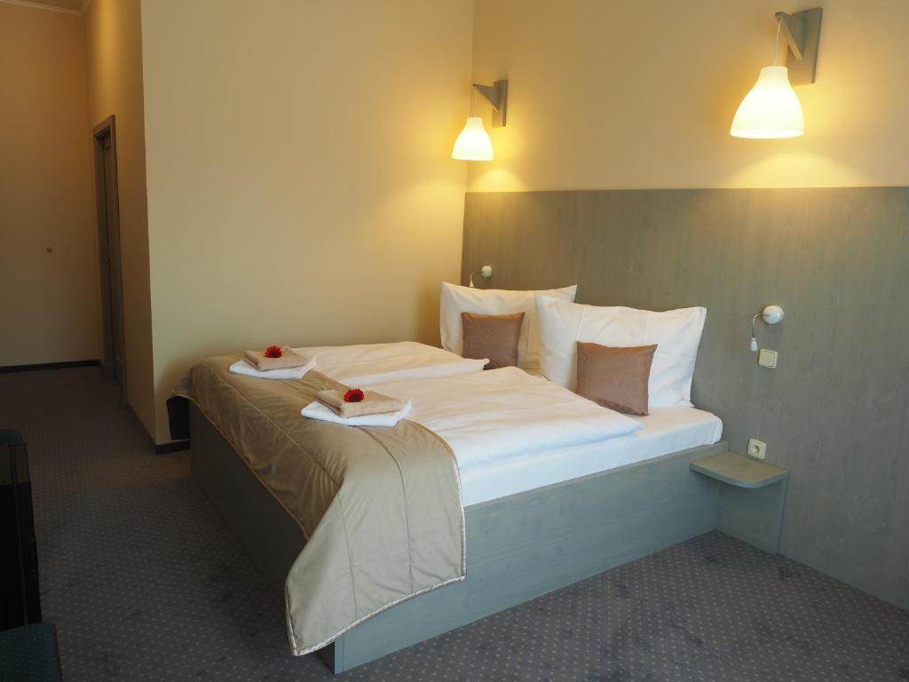 Postel nebo postele na pokoji v ubytování Hotel Výpřež - Děčín