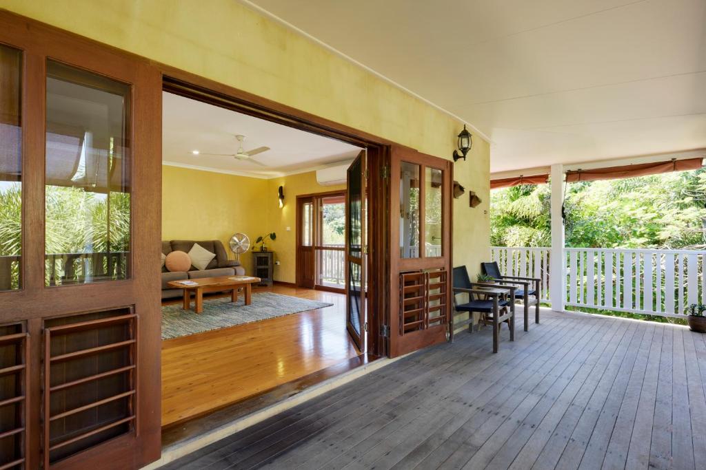 an open door to a porch with a living room at Tropical Styling in Cooktown