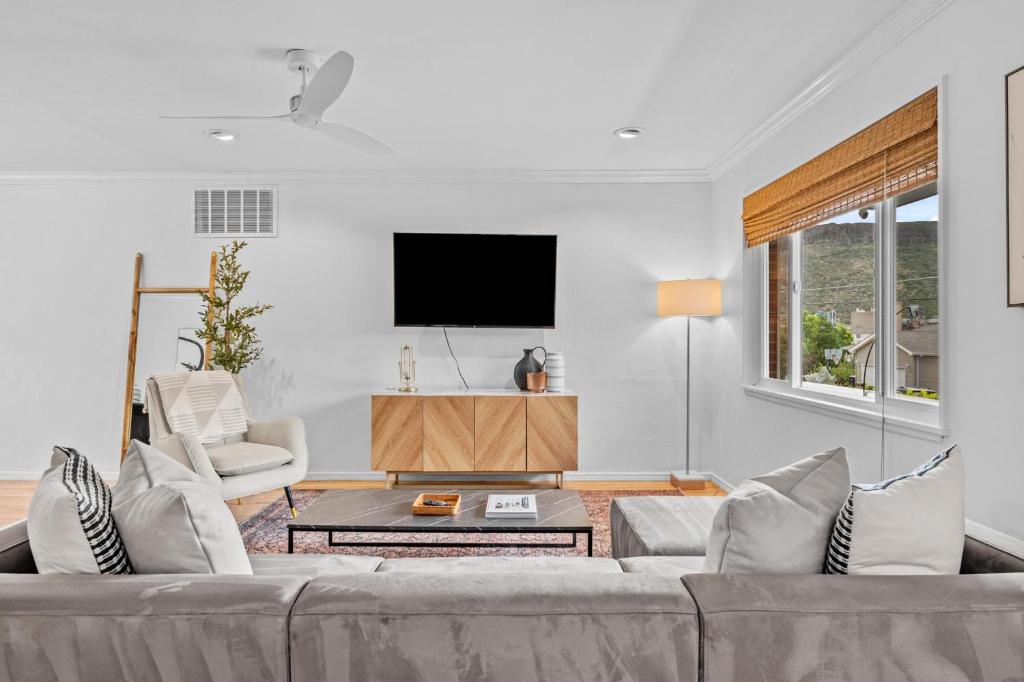 a living room with a couch and a tv at 204 High Pkwy - Golden in Golden