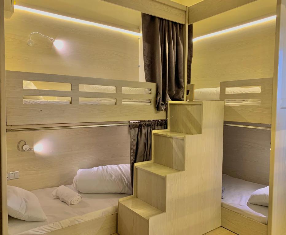 a small room with two bunk beds in it at Marina Homes in Dubai