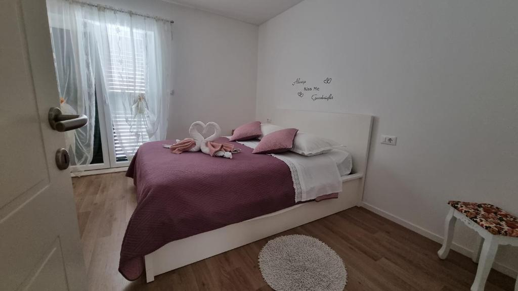 Postel nebo postele na pokoji v ubytování Apartment Pino