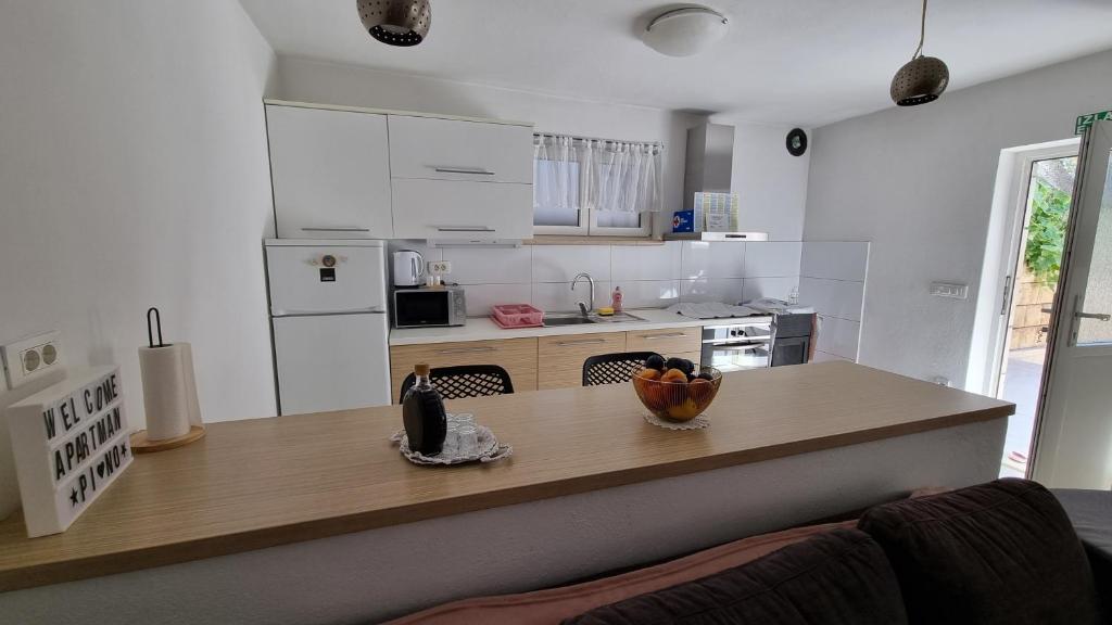 Kuchyň nebo kuchyňský kout v ubytování Apartment Pino