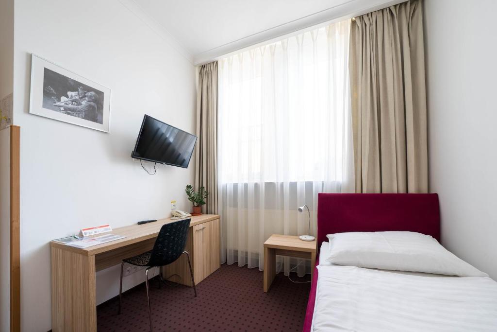 TV a/nebo společenská místnost v ubytování Mini Hotel Akord