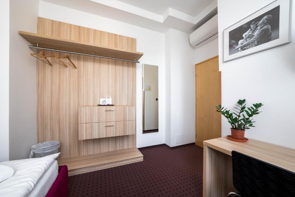 Postel nebo postele na pokoji v ubytování Mini Hotel Akord
