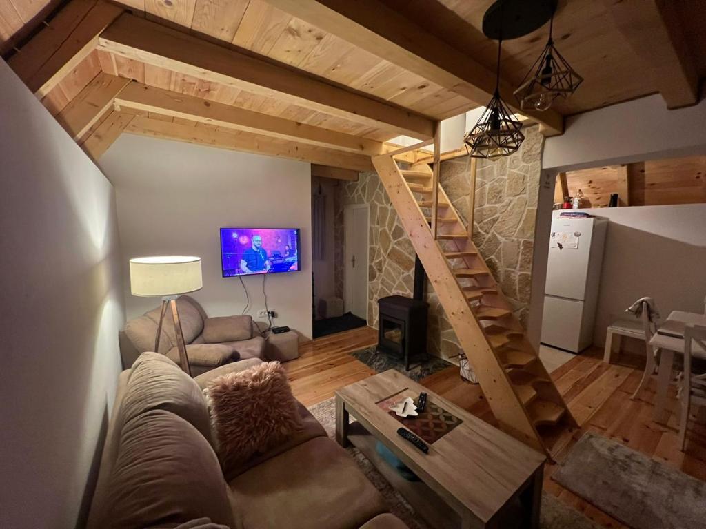 a living room with a couch and a table at Žabljak- FamilyOasis in Žabljak