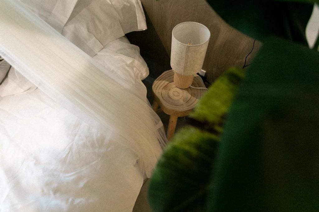 Postel nebo postele na pokoji v ubytování Bali Serenity Balnéo et lit rond