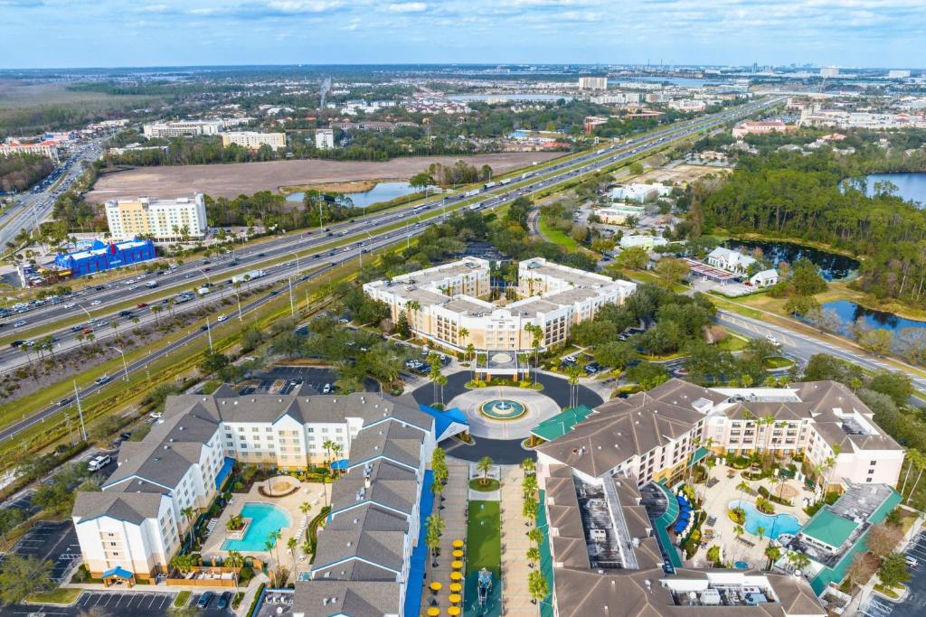 an aerial view of a resort with a highway at SpringHill Suites by Marriott Orlando Lake Buena Vista in Marriott Village in Orlando