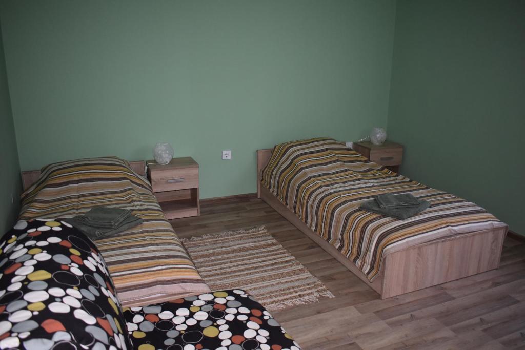 two beds sitting next to each other in a room at Apartment Airport Sofia in Sofia