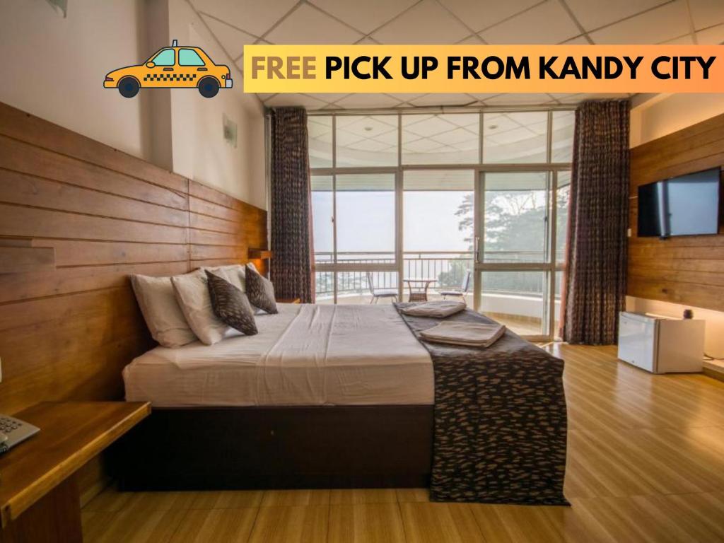 a bedroom with a large bed with a car on it at Kandyan View Holiday Bungalow in Kandy