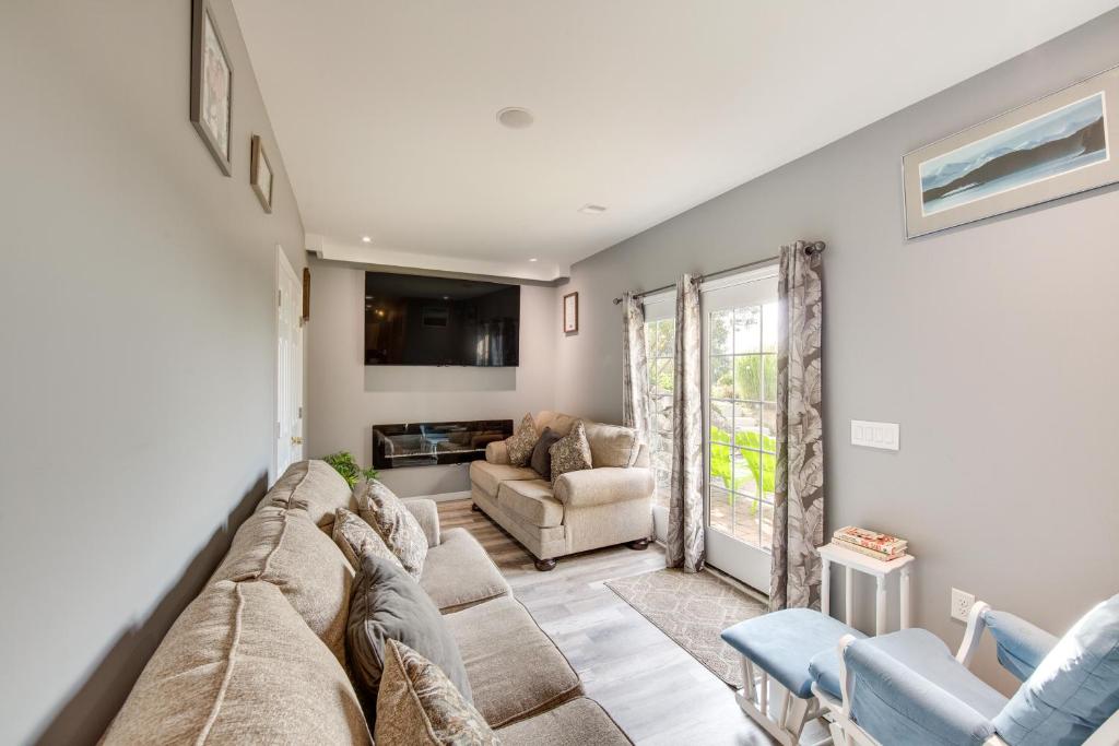 a living room with a large couch and chairs at Mountville Rental with Private Patio and Gas Grill! in Mountville