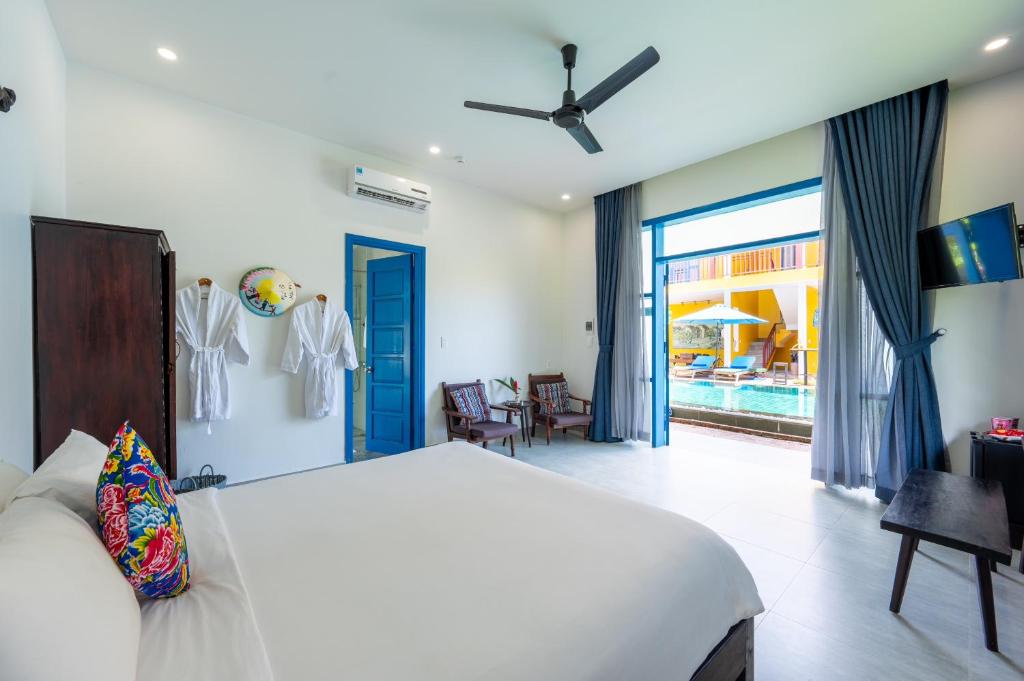 Postel nebo postele na pokoji v ubytování Chez Mimosa Hoi An - LUA Retreat