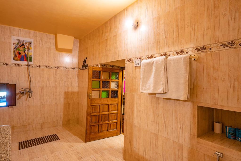 a bathroom with a shower and a sink and a shower at Hotel Garh Jaisal Haveli in Jaisalmer