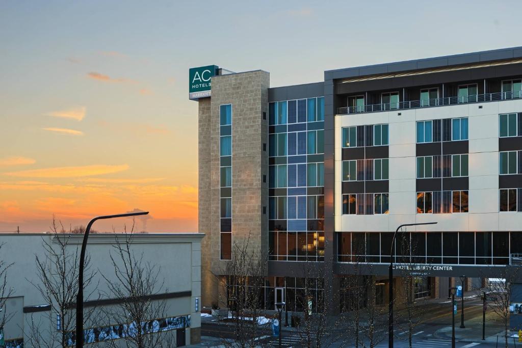 a building with a sign on top of it at AC Hotel Cincinnati at Liberty Center in West Chester