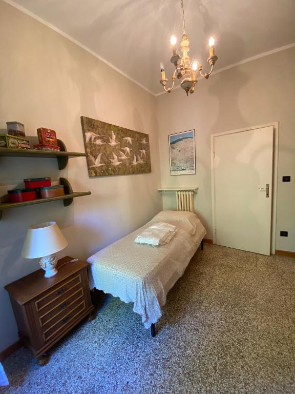 Postel nebo postele na pokoji v ubytování Arcobalenotoscano Convivio