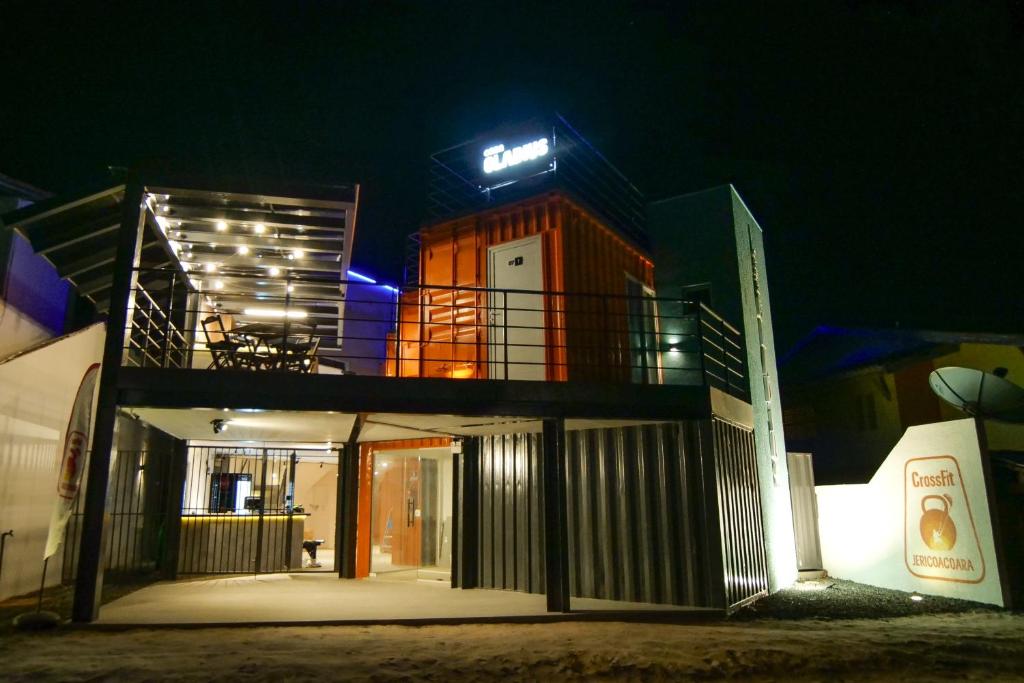 a building with a balcony on the top of it at night at Casa Gladius in Jericoacoara