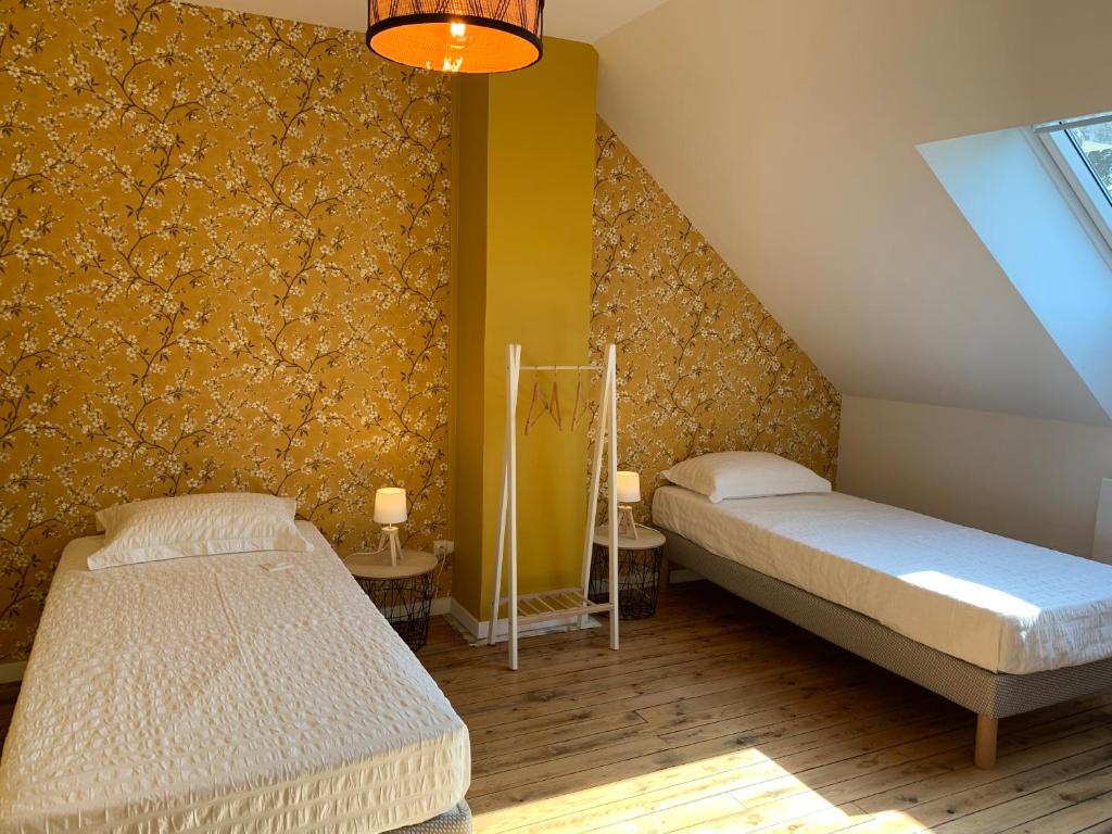 Postel nebo postele na pokoji v ubytování COTTAGE DU PARC