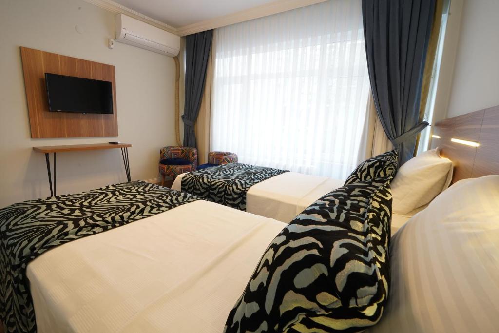 Postel nebo postele na pokoji v ubytování My Suite House