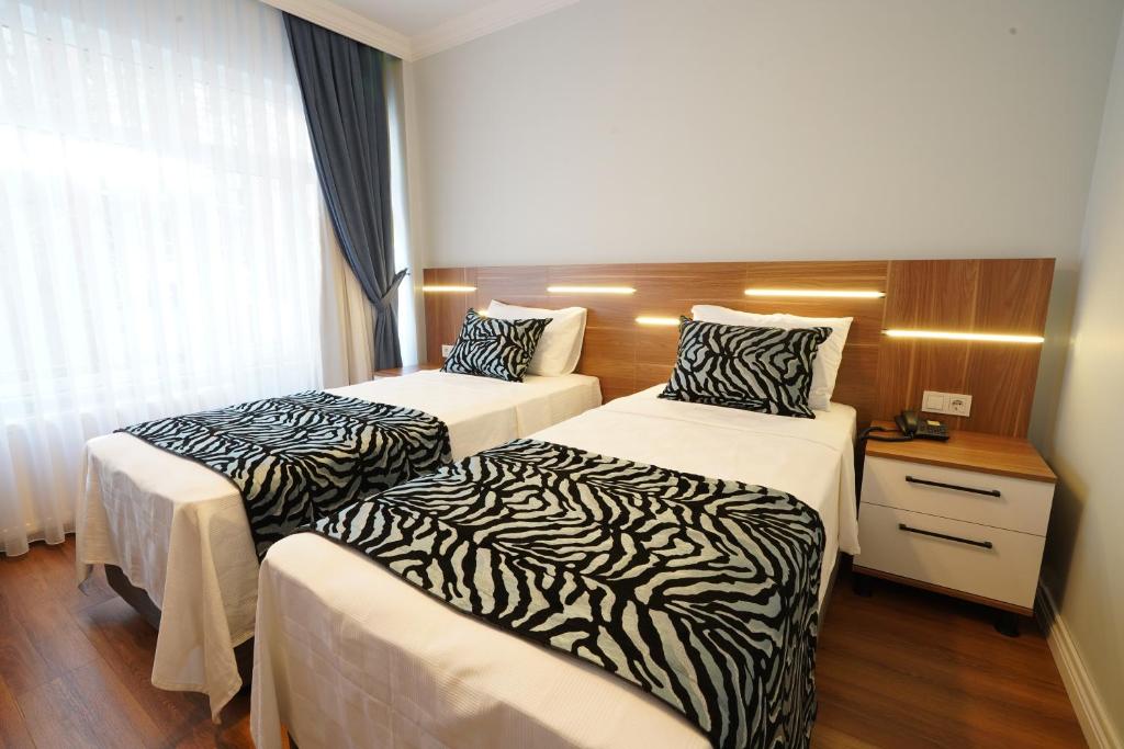 Postel nebo postele na pokoji v ubytování My Suite House