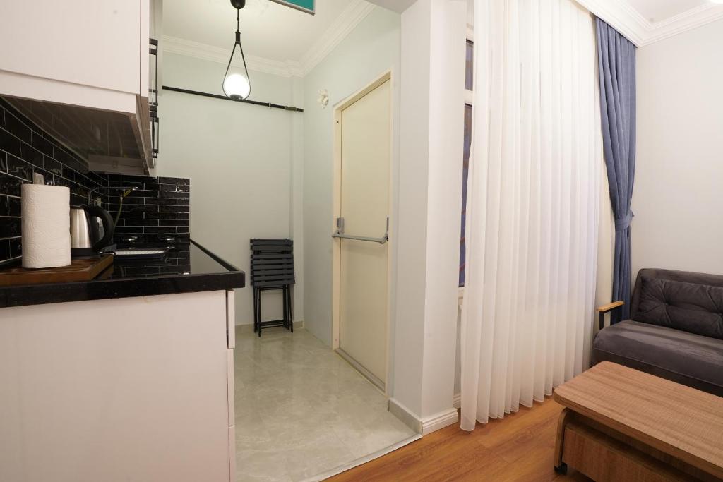 Kuchyň nebo kuchyňský kout v ubytování My Suite House
