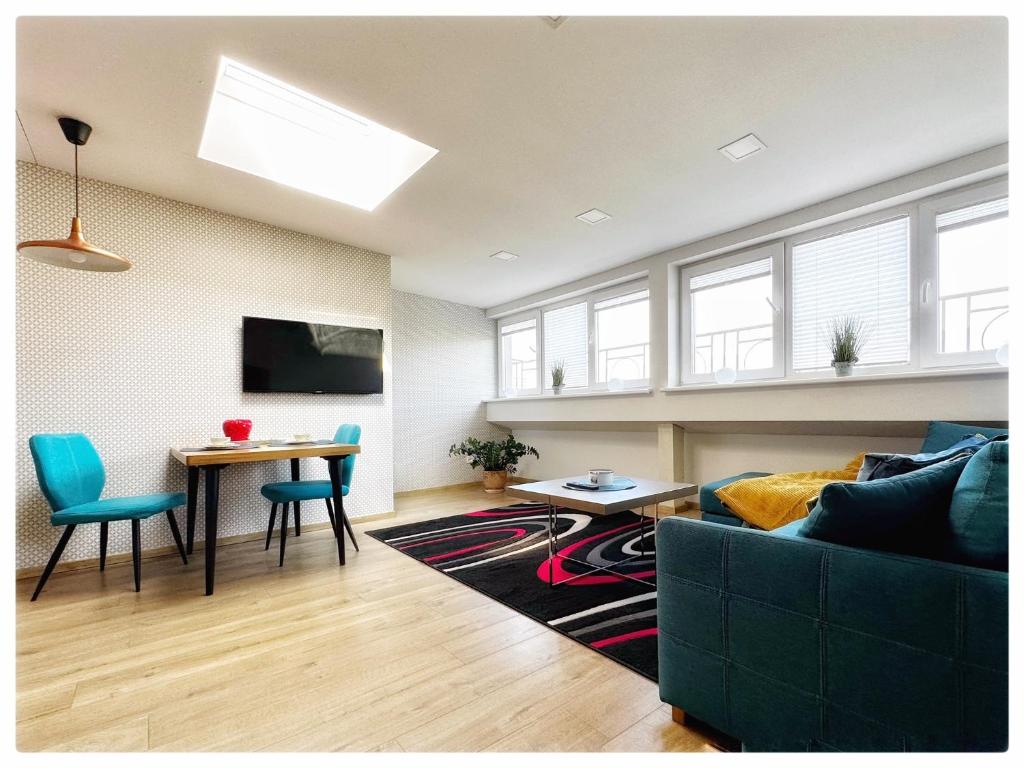 a living room with a couch and a table at Apartaments in the city centre in Kaunas