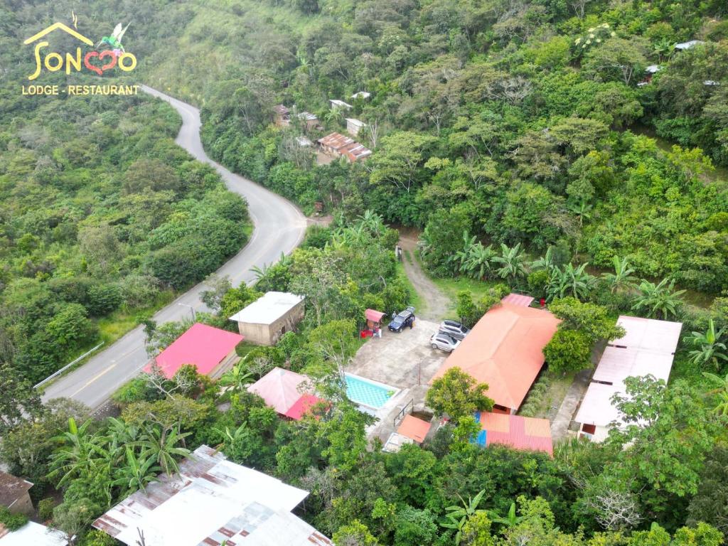 an aerial view of a house and a road at SONCCO LODGE in Quillabamba