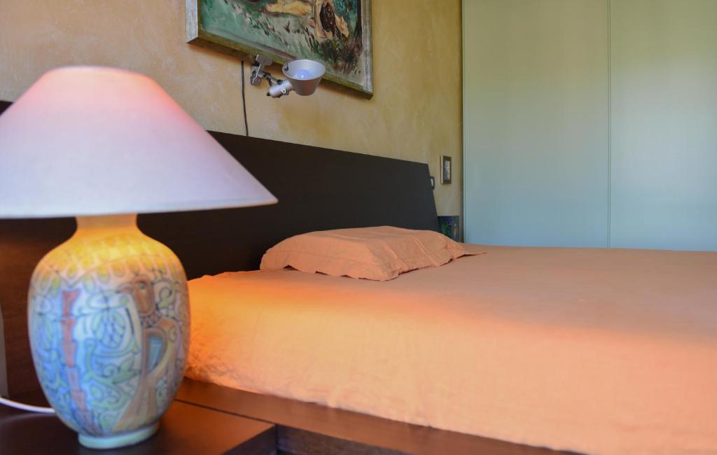 Postel nebo postele na pokoji v ubytování A Casa di Lidia 15 min dal Lago di Garda e Verona Centro Vicinissima Terme Acquardens