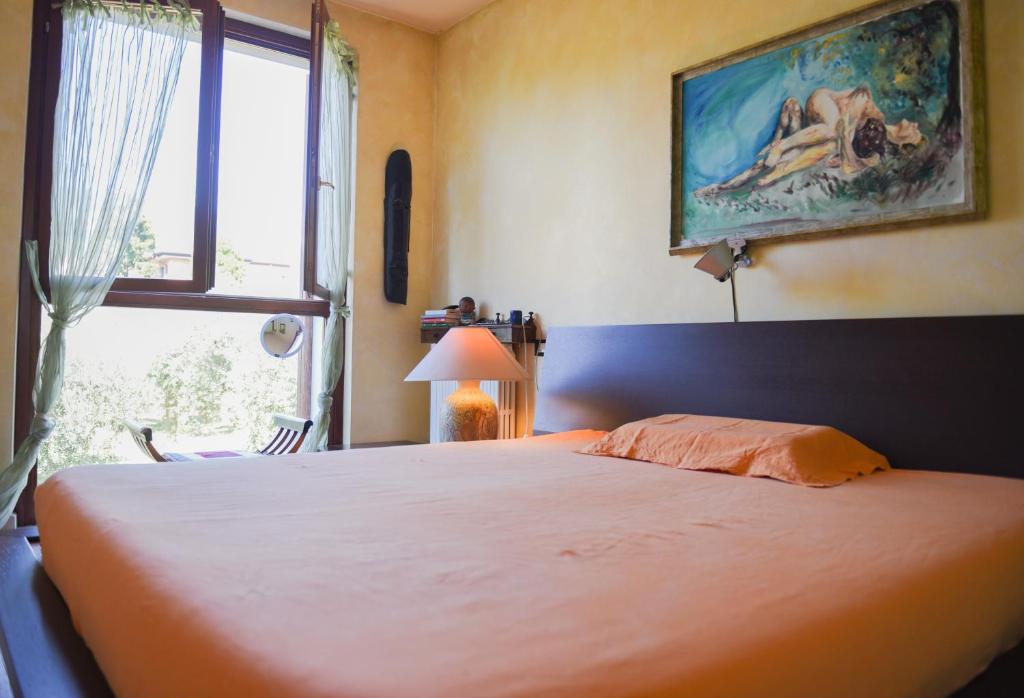 Postel nebo postele na pokoji v ubytování A Casa di Lidia 15 min dal Lago di Garda e Verona Centro Vicinissima Terme Acquardens