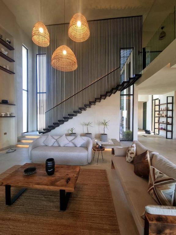 a living room with a couch and a table at The Gate in Sur