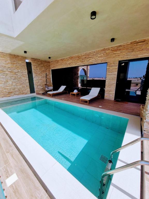 a swimming pool in a house at The Gate in Sur
