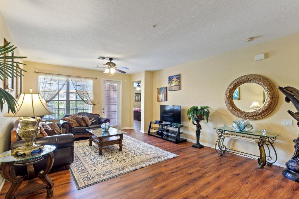 a living room with a couch and a table at Executive 3 Bedroom Villa at Universal in Orlando