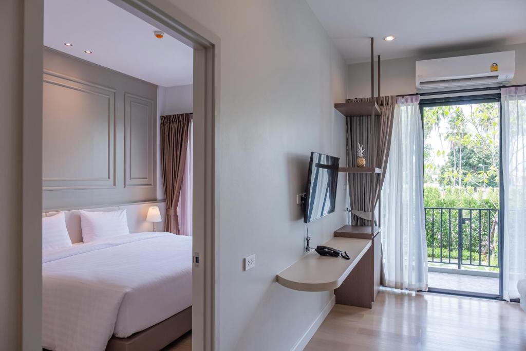 Postel nebo postele na pokoji v ubytování Wellington Hotel Prachuapkhirikhan