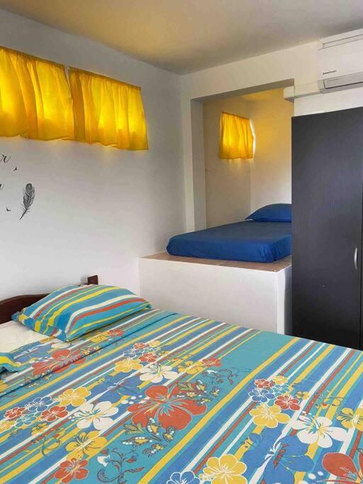 Postel nebo postele na pokoji v ubytování Le Bleu de L'Anse